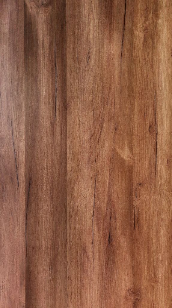 Solid Prefinished Hardwood Flooring Solid prefinished hardwood flooring with a warm brown tone, natural wood grain patterns, and a smooth, polished surface.
