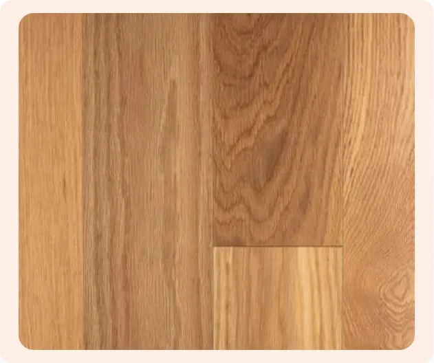 solid prefinished hardwood flooring with a natural oak finish Close-up of solid prefinished hardwood flooring with a natural oak finish, showcasing wood grain patterns and smooth surface.